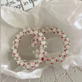 Set of two white spiral hair ties with red cherry patterns on decorative paper - Cherry