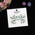 Detail of emerald green and clear crystal rhinestone face stickers for eye decoration - Green AB