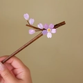 Close-up of bamboo hair stick featuring delicate pink cherry blossoms and glass beads - Pink Sakura (S386)
