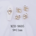 Macro shot of 9x11mm golden cross flower nail charms with clear rhinestones set of 5 - Transparent White Gem - Gold Tone Base (MZH-9605)