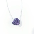 Detailed macro view of raw purple amethyst crystal pendant on silver link chain - Deep Amethyst