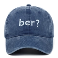 Detailed macro view of white 'ber?' embroidery on a vintage navy washed baseball cap. - Navy Blue
