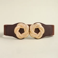 Detail of interlocking golden metal buckle on a brown elastic wide waist belt for dresses - Coffee