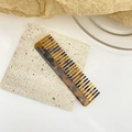 Vintage tortoiseshell acetate hair comb with amber marble pattern on stone base - Small Amber