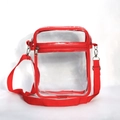 Clear PVC crossbody travel bag with red trim and adjustable shoulder strap - Red