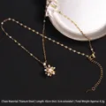 Gold plated stainless steel star pendant necklace with zircons on a textured black background - Starburst Micro-inlaid Zirconia (A698)