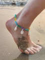 Detail of bohemian ankle bracelet with colorful beads and natural shells on the beach - Sx697 - Shell Anklet With Seed Beads