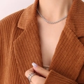 Silver interlocking chain necklace and geometric hollow ring set worn on model - Silver Steel Interlocking Geometric Necklace