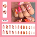 Close-up view of vibrant almond-shaped press-on nails with chili and fruit patterns - Cute Vegetables And Fruits (W197)
