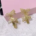 Set of 2 golden hollow butterfly hair clips with elegant metallic filigree detail - Butterfly Pair (2 Pcs/Set) / Imitation Gold