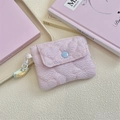 Macro shot of pink heart-quilted coin purse with snap button and blue bear charm - Heart Pink Stripes
