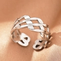 Detailed macro shot of silver braided chain links and hollow texture on a sleek open ring - Silver Braided Chain (C1474)