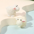 Two cartoon-style white resin sheep ornaments with pink ears and cute black eyes - Little Goat