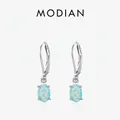 Elegante s925 Silber Ohrhänger mit schillernden Opalsteinen auf einem grauen Hintergrund - S925 Sterling Silber Opal Stil