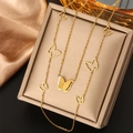 Detailed macro view of golden double-layered butterfly pendant on a luxury jewelry box - Gold N-74 (Double Layer Hollow Butterfly)