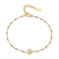 Detail of 18k gold plated bracelet featuring grey enamel beads and Tree of Life charm - Gray
