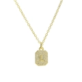 Detailed view of gold square pendant with letter L and micro-pave cubic zirconia - Necklace L