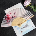 Classic folding fan with plum blossom and bird ink painting, featuring a gray tassel - Plum Blossom Joy - Light Color Handle