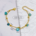 Double-layered golden bracelet with blue stones and white pearls, adjustable length - Large Green Stone