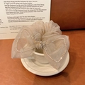 Champagne mesh bow hair scrunchie with rhinestones elegantly placed in a white teacup - Gray Purple