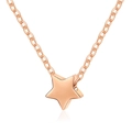 Detail view of a rose gold five-pointed star pendant on a classic O-chain necklace - Star Rose Gold