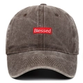 Detail of red rectangular embroidered patch with Blessed text on washed grey baseball cap - Coffee