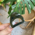 Detailed close-up of a dark green resin hair claw clip with golden metal spring - Mini Cat Ear / Translucent Grey Green