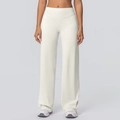 Dettaglio dei pantaloni yoga color crema a vita alta con gamba larga e tessuto morbido - S / Avorio Chiaro