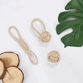 Detail of durable beige cotton rope pet toys with woven ring and knot on wooden background - 3-Piece Set 295g