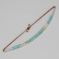 Handmade Tila bead bracelet featuring turquoise and gold accents on adjustable brown cord - Turquoise Iridescent Gold