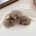 Brown and beige fluffy rabbit fur hair claw clip in a natural decorative setting - Coffee Leopard