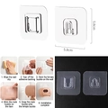 Set di ganci adesivi trasparenti da 5,8 cm con sistema di fissaggio per pareti - Bottone a pressione / Trasparente