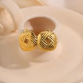 Titanium steel square earrings in 18k gold finish with woven texture on cream stand - Geometric Hollow Studs