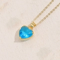 Elegant gold chain necklace featuring a brilliant blue heart-shaped glass pendant - Light Blue Zirconia