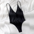 Minimalist black one-piece swimsuit with deep V-neck and thin spaghetti straps - Black