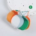 Colorful clover claw clip with green, orange, and blue resin finish on round tray - Multicolor Patchwork Hair Claw