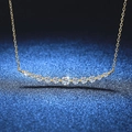 Elegant gold S925 silver necklace with curved moissanite pendant on dark blue background - 1.1 Carat Moissanite (18K Gold Color)