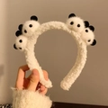 Bandeau en peluche blanche avec têtes de panda 3D pour soins de peau et maquillage - Quatre pandas