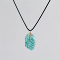 Detail of blue natural crystal stone pendant wrapped in handmade golden wire with cord - Amazonite