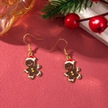 Detail of gingerbread man Christmas earrings with alloy drip oil on festive red background - D1300 (Bear Cookie)