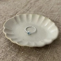 925 silver twist rope ring with light blue gemstone in an elegant ceramic dish - Twisted Rope Blue Gemstone Opening Style(JZ0035)