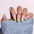 Almond-shaped French press-on nails with yellow tips and white star heart patterns - Glue Type