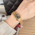 Elegant gold snake-style watch for women with black oval dial and Roman numerals - Gold Black