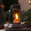 Vintage Christmas telephone booth lantern with reindeer pattern on rustic books - Antique Silver Reindeer