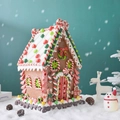 Detailed view of gingerbread candy house ornament with festive red and white candy pillars - X-Large Gingerbread Man 20*21*34.5cm
