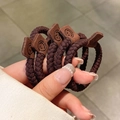 Elastic dark brown woven hair tie featuring a cute leather smiley face charm decor - Mesh Smile Tag / Dark Coffee Mesh Smile