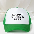 Detail of green and white trucker hat with Daddy Needs A Beer print on the front - One Size / Green