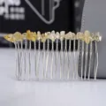 Macro detail of natural yellow crystal stones hand-wrapped on a silver metal hair comb - Citrine + 20-Tooth Silver Comb