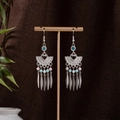 Detail of Bohemian tassel earrings with colorful beads on a vintage metal display stand - Multicolor Silver (E1032-1)