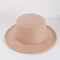 Top view of a camel wide brim wool felt hat with a flat top design on white background - Camel